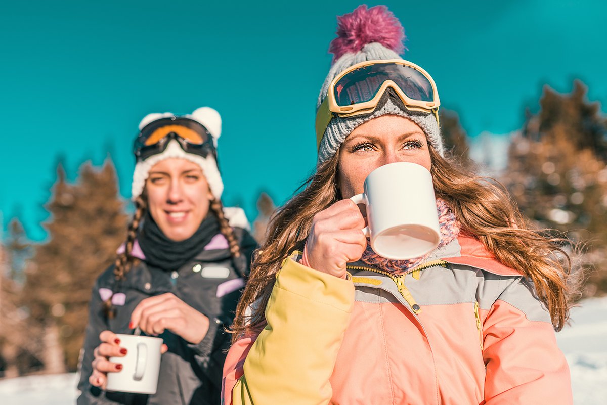 friends enjoying the winter day on mountain